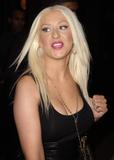 Christina Aguilera in low-cut black top shows her big breasts in New York