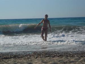 Unknown girl playing topless in Korfu beach Greece-w4evc1deww.jpg